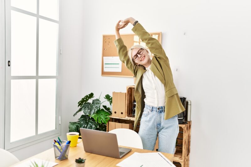 Woman stretching - The Modern Memo Boost Your Metabolism Naturally with This Easy 30-Minute Daily Habit