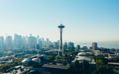 Seattle skyline with Space Needle centered against blue sky, clear day